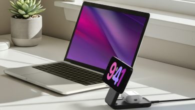 Belkin UltraCharge 2in1 wireless charger on a white desk, next to a laptop