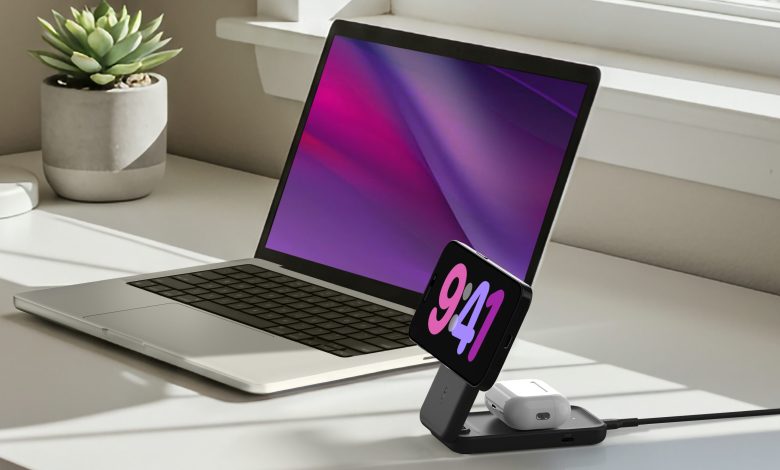 Belkin UltraCharge 2in1 wireless charger on a white desk, next to a laptop