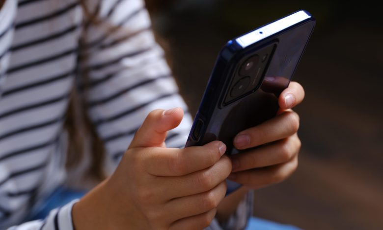 the hands of a child holding the HMD Fuse