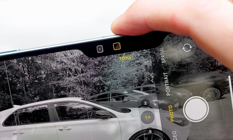 A person using the Camera Control on the Apple iPhone 16 Plus.